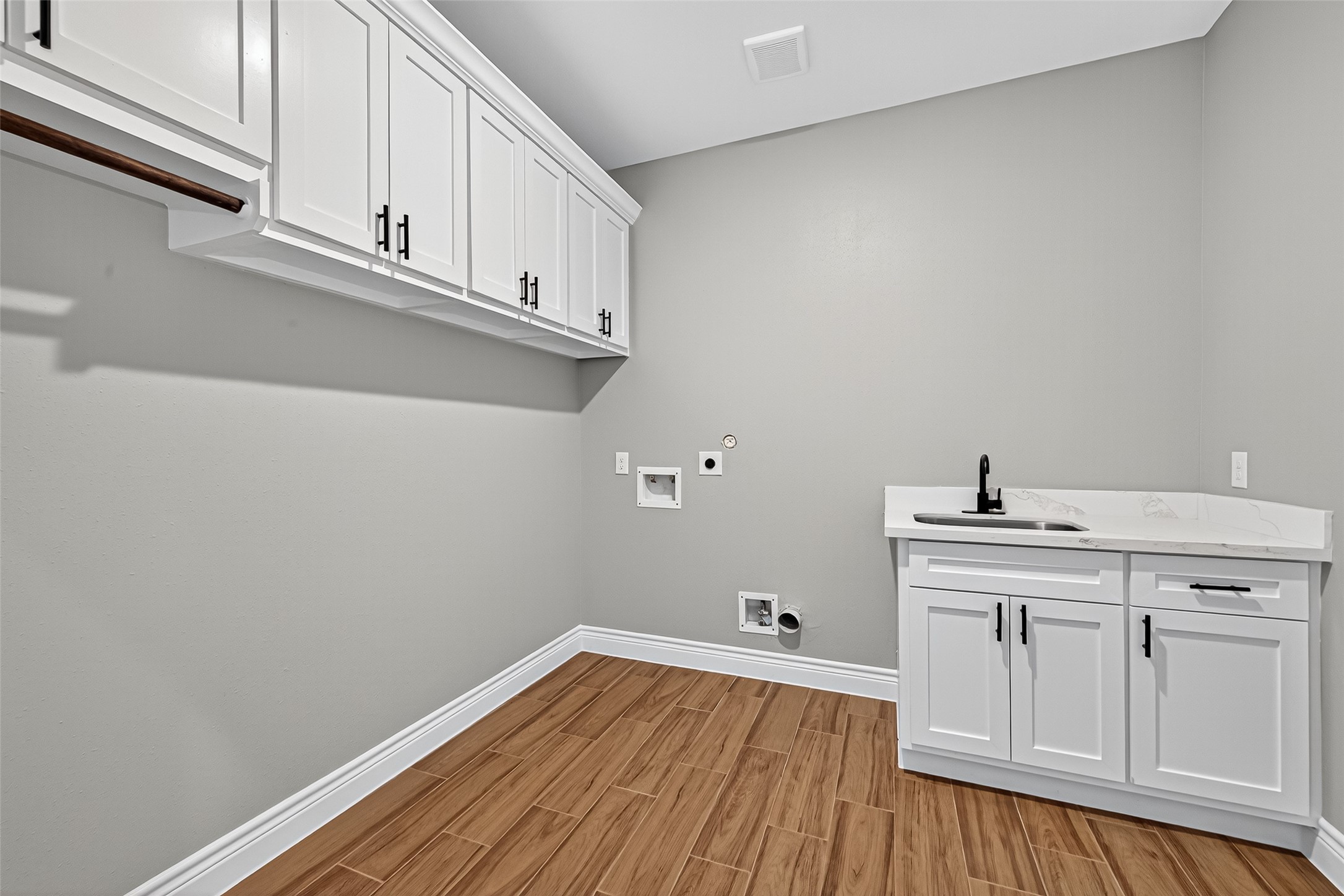 501 Oleander Street Hempstead, TX 77445 - Photo 27 of 48 a view of a kitchen with electric board and wooden floor