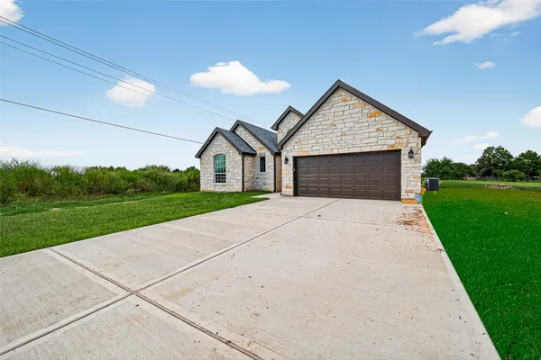 a front view of a house with yard
