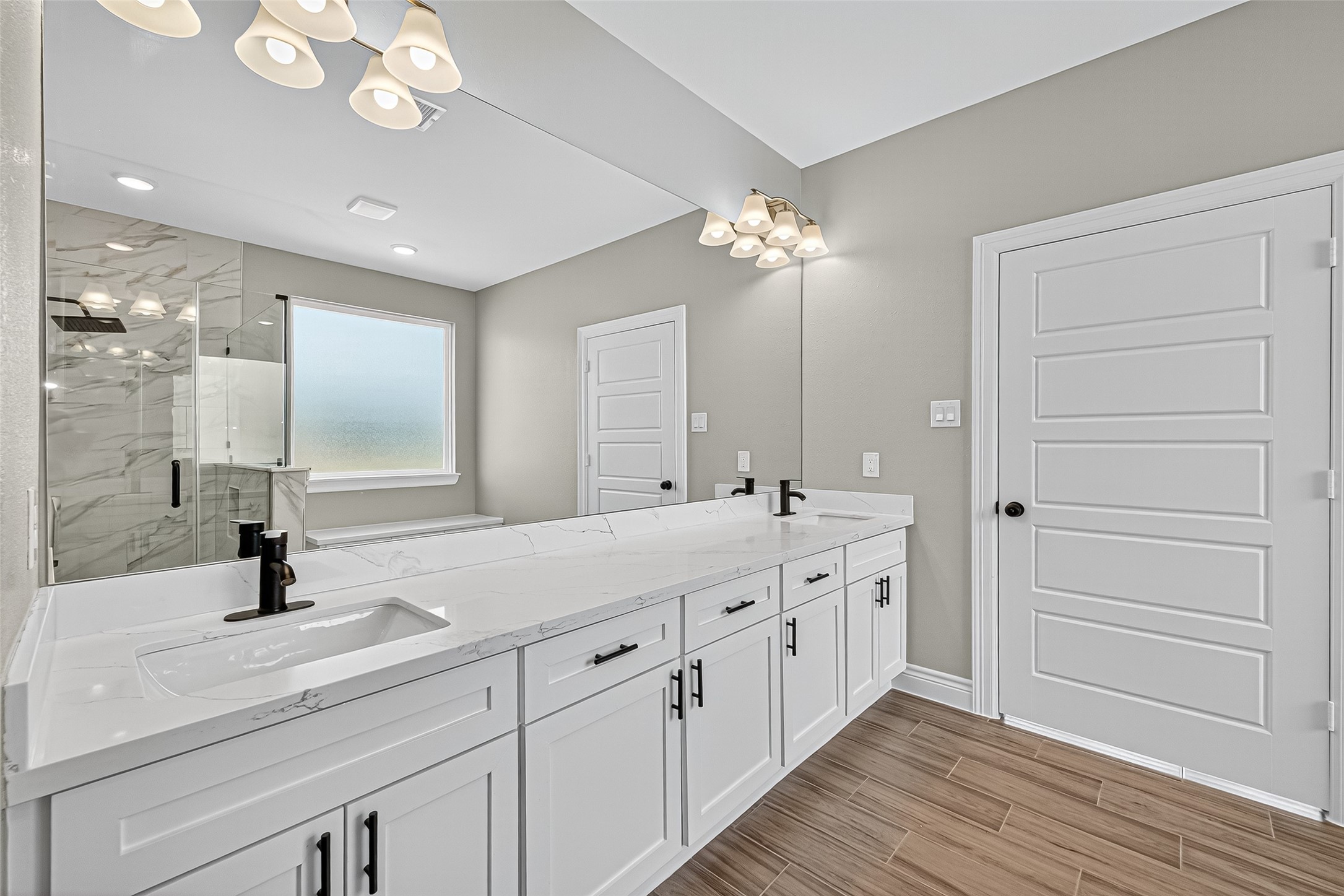 501 Oleander Street Hempstead, TX 77445 - Photo 35 of 48 a bathroom with a double vanity sink and a mirror