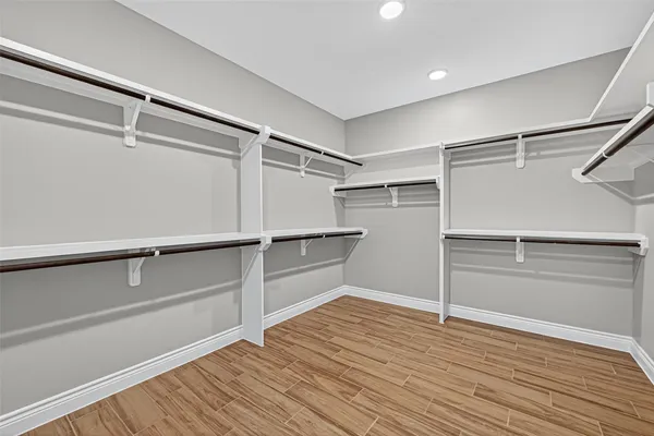 a view of an empty walk in closet