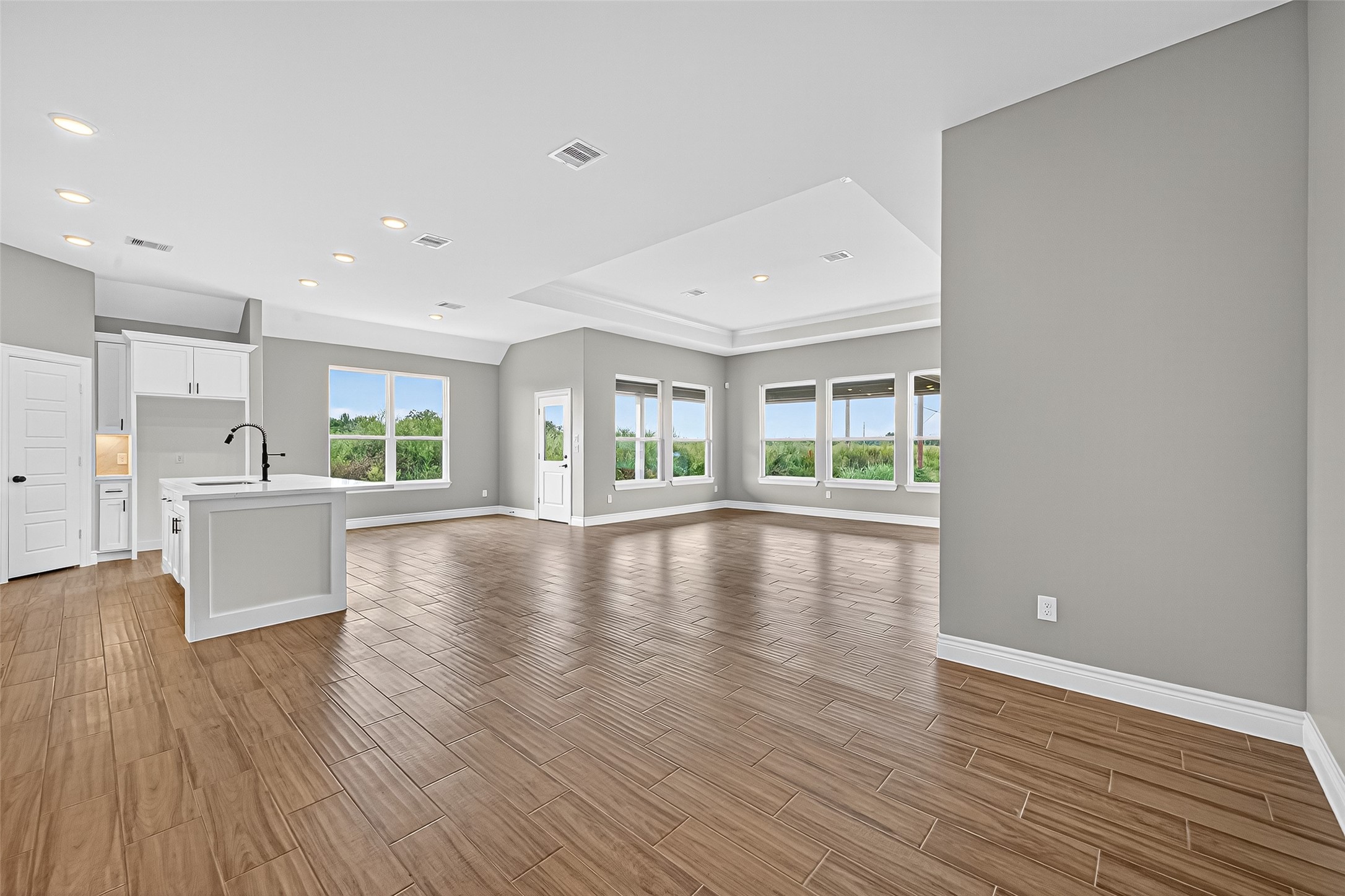501 Oleander Street Hempstead, TX 77445 - Photo 9 of 48 a view of an empty room with wooden floor and a window