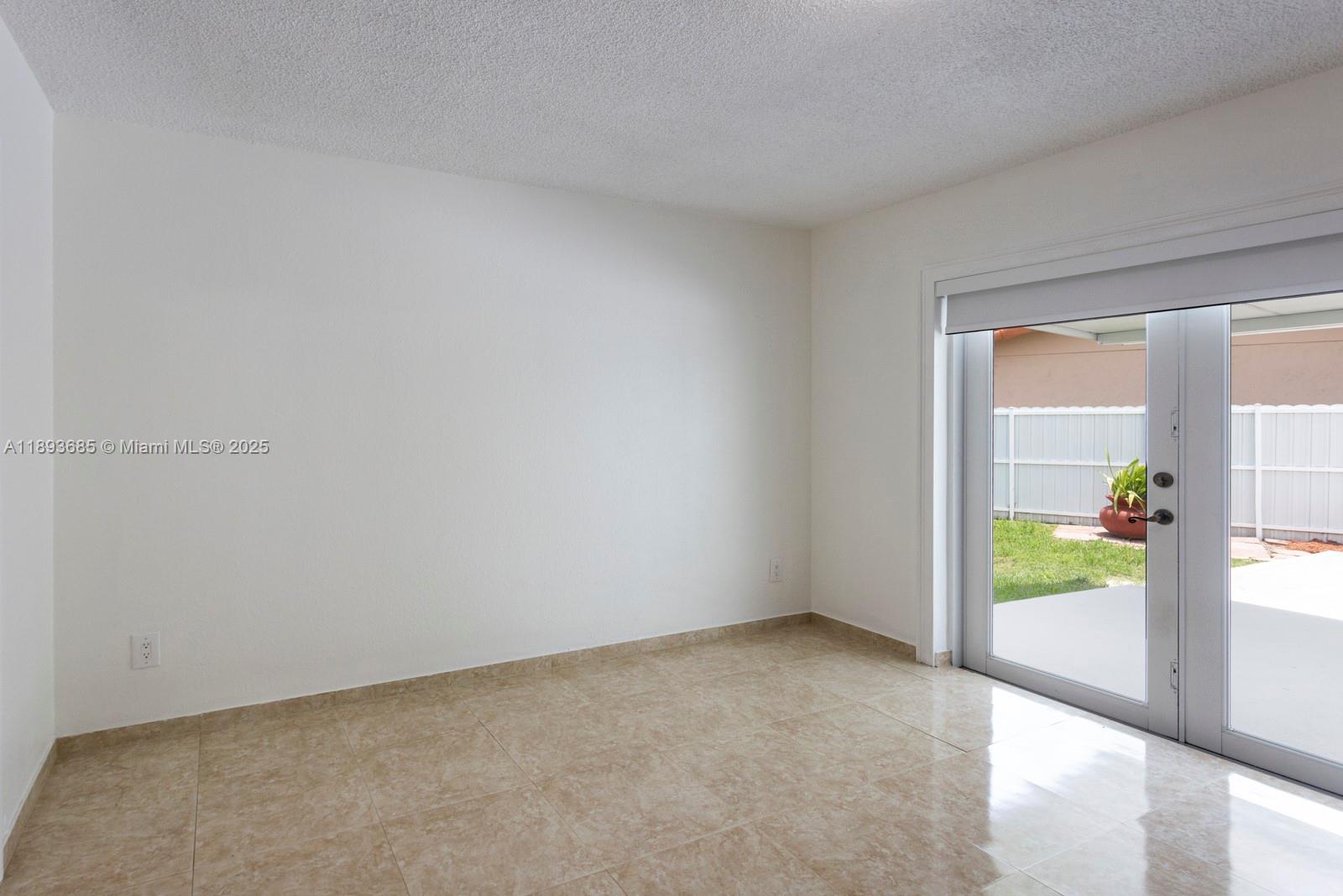 10770 Southwest 26th Street Miami, FL 33165 - Photo 13 of 35 a view of an empty room and a window