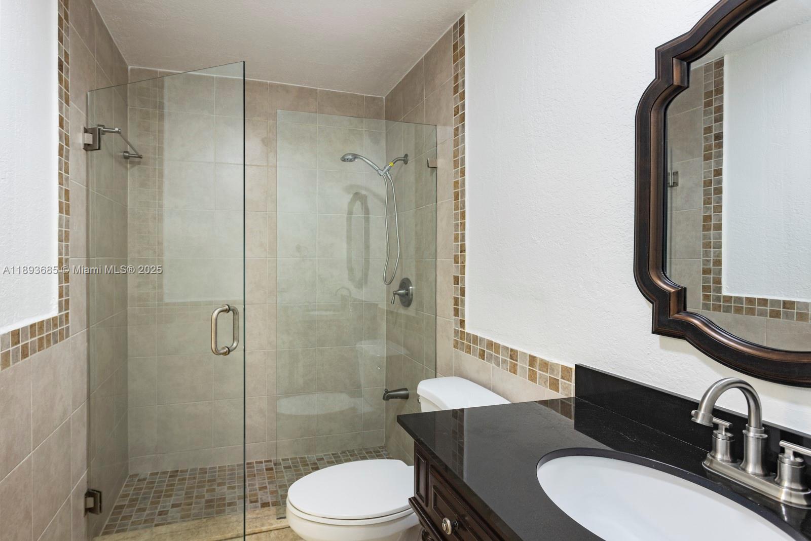 10770 Southwest 26th Street Miami, FL 33165 - Photo 17 of 35 a bathroom with a sink a toilet and shower