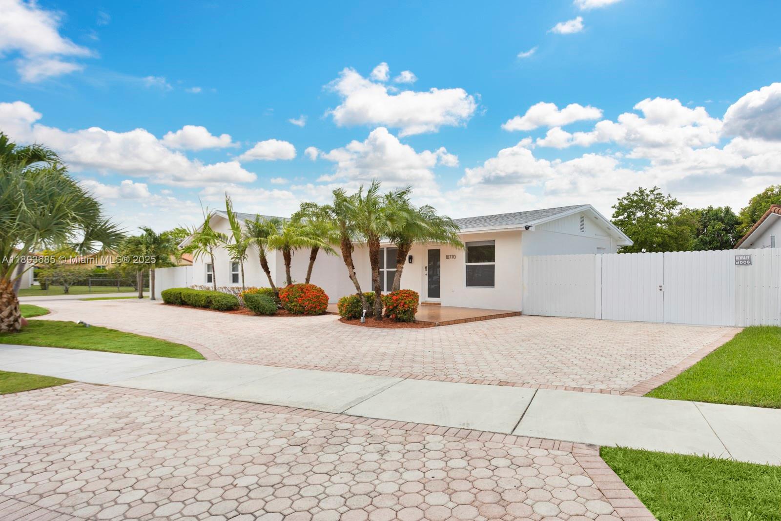 10770 Southwest 26th Street Miami, FL 33165 - Photo 2 of 35 a view of a house with entertaining space