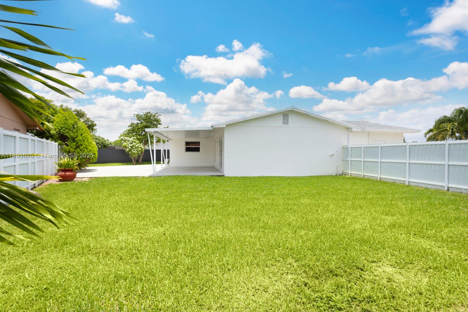 10770 Southwest 26th Street Miami, FL 33165 - Photo 29 of 35 a view of a house with a backyard