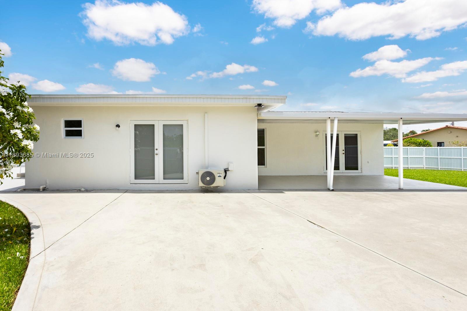 10770 Southwest 26th Street Miami, FL 33165 - Photo 30 of 35 a view of a building with a outdoor space