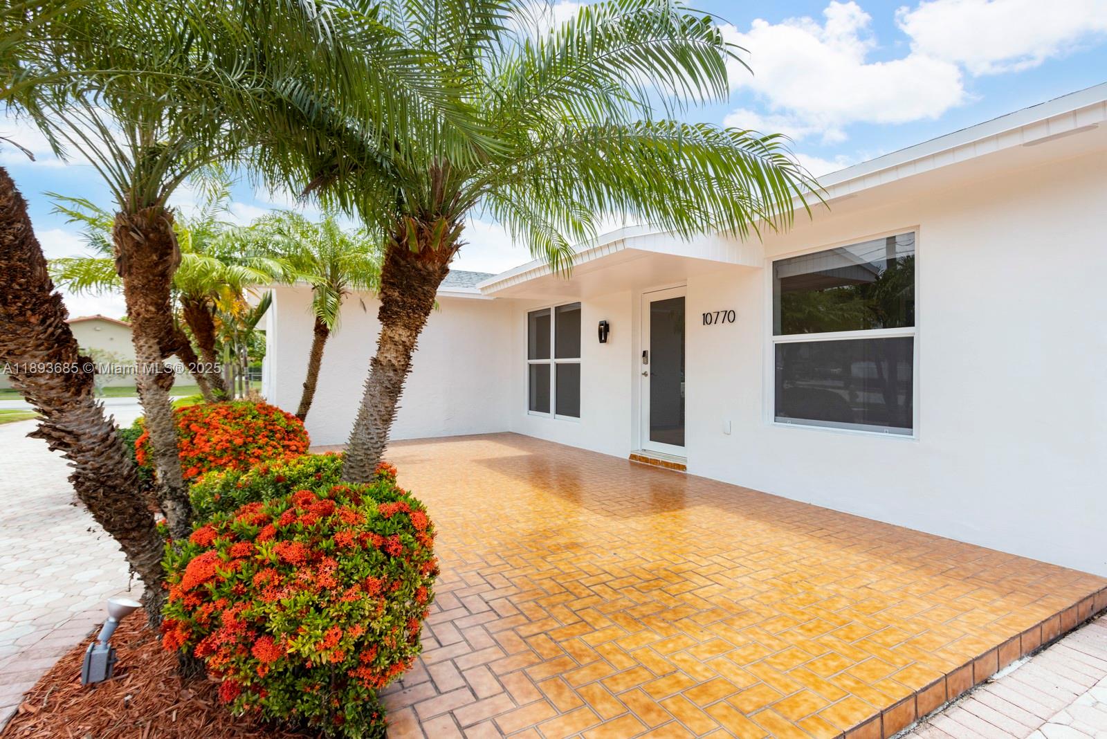 10770 Southwest 26th Street Miami, FL 33165 - Photo 4 of 35 a front view of house with yard