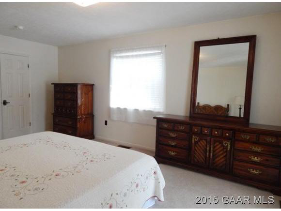 660 Ladd Road Fishersville, VA 22939 - Photo 22 of 40 a bedroom with a bed and a mirror on dresser