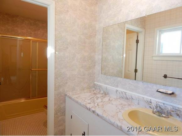 660 Ladd Road Fishersville, VA 22939 - Photo 23 of 40 a bathroom with a granite countertop sink and a mirror