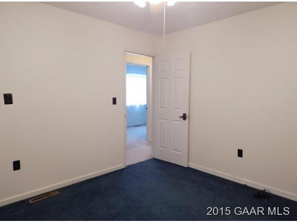 660 Ladd Road Fishersville, VA 22939 - Photo 29 of 40 an empty room with wooden floor and cabinet