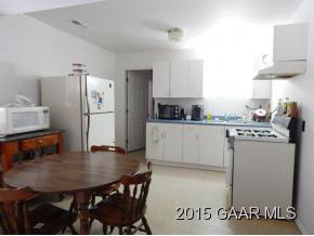 660 Ladd Road Fishersville, VA 22939 - Photo 32 of 40 a kitchen with stainless steel appliances a kitchen island a stove a table and chairs