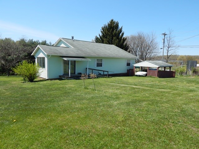660 Ladd Road Fishersville, VA 22939 - Photo 36 of 40 a view of a house with a yard and sitting area