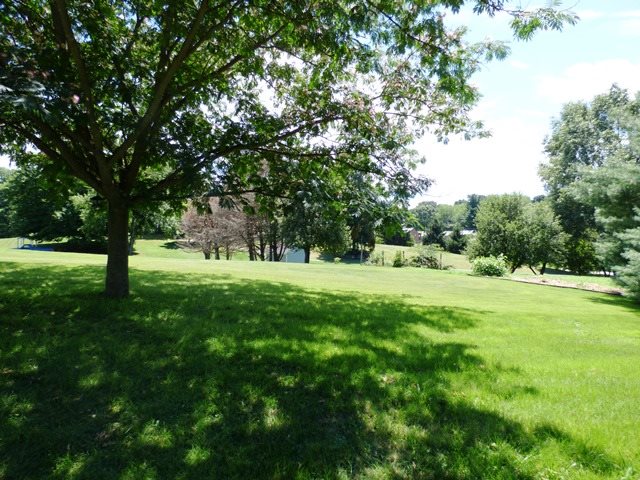 660 Ladd Road Fishersville, VA 22939 - Photo 39 of 40 a view of green field with trees in the background