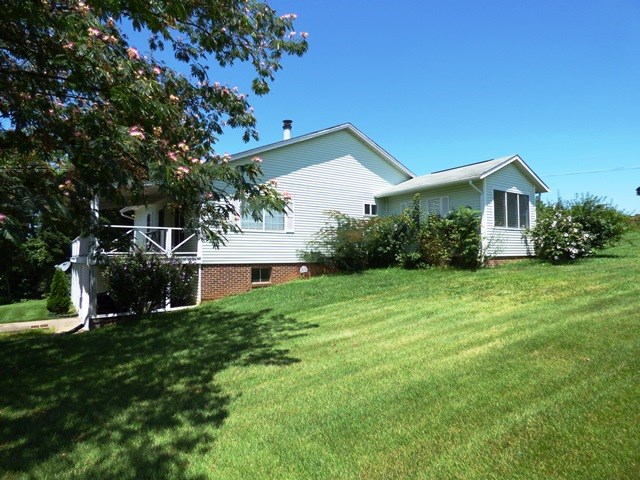 660 Ladd Road Fishersville, VA 22939 - Photo 8 of 40 a view of a house with backyard and garden
