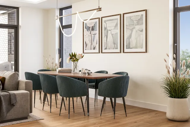 a dining room with furniture and wooden floor