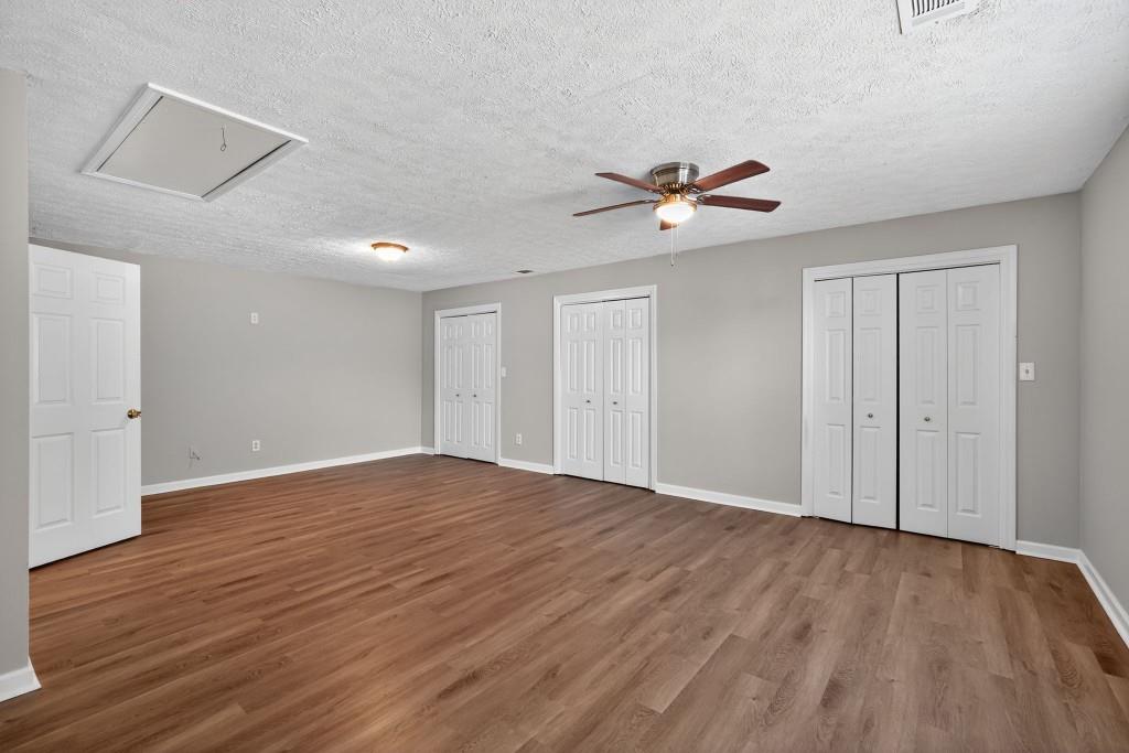 3737 Waldrop Road Decatur, GA 30034 - Photo 15 of 23 a view of an empty room with a window and wooden floor