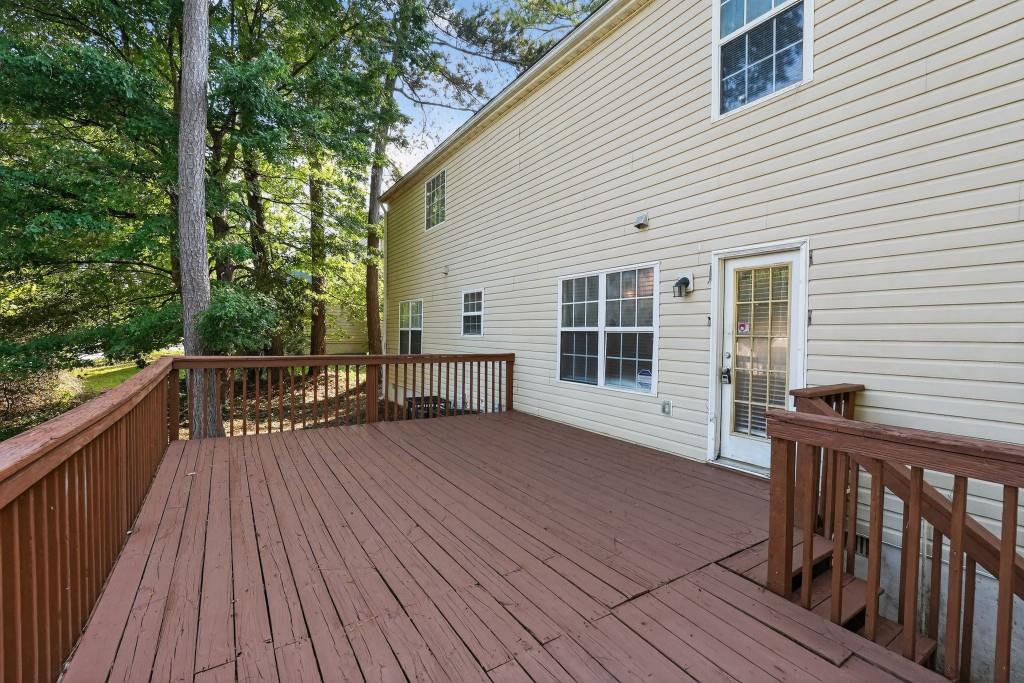 3737 Waldrop Road Decatur, GA 30034 - Photo 21 of 23 a view of deck with wooden floor and fence next to a yard
