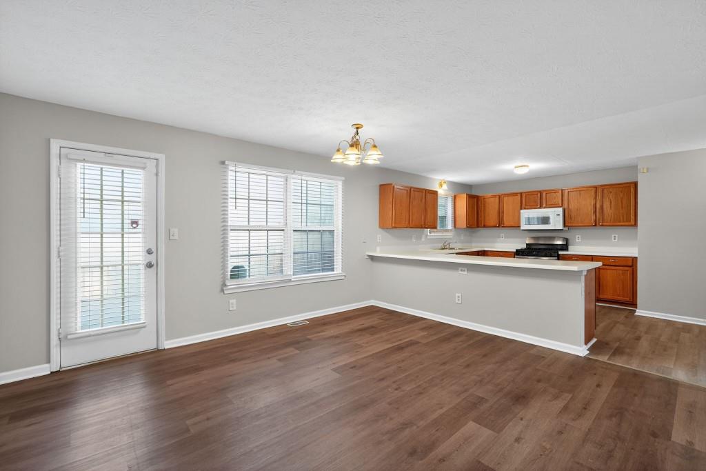 3737 Waldrop Road Decatur, GA 30034 - Photo 3 of 23 a view of kitchen with wooden floor and electronic appliances