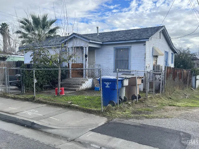 a view of a house with a patio and potted plants