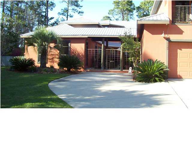 4496 Woodbridge Road Niceville, FL 32578 - Photo 1 of 25 a black and white photo of a house