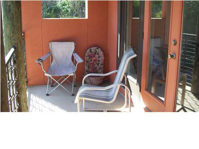 4496 Woodbridge Road Niceville, FL 32578 - Photo 14 of 25 a view of a dining room with a table and chairs