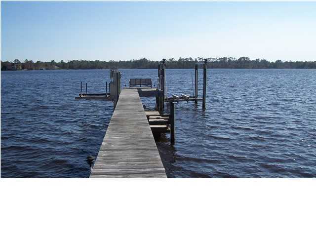 4496 Woodbridge Road Niceville, FL 32578 - Photo 4 of 25 a black and white photo of a lake