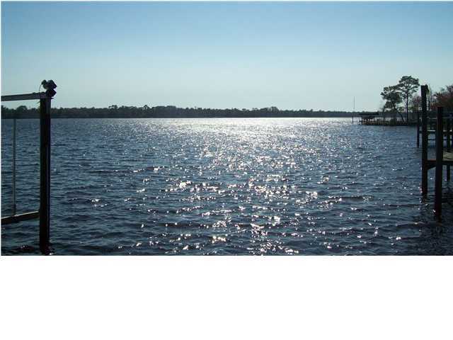 4496 Woodbridge Road Niceville, FL 32578 - Photo 5 of 25 a black and white photo of a lake