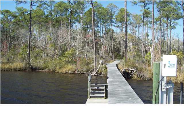 4496 Woodbridge Road Niceville, FL 32578 - Photo 8 of 25 a black and white photo of a lake