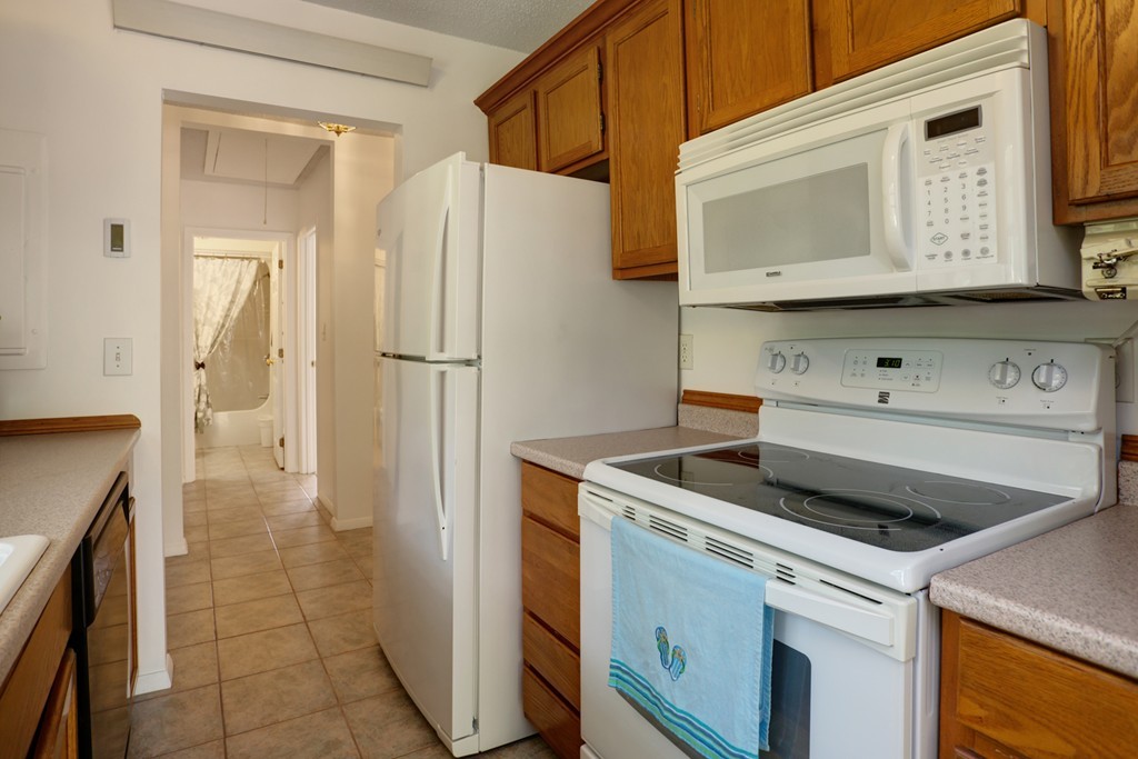 20 Round House Road, Unit 20 Bourne, MA 02532 - Photo 13 of 22 a kitchen with a refrigerator sink and cabinets