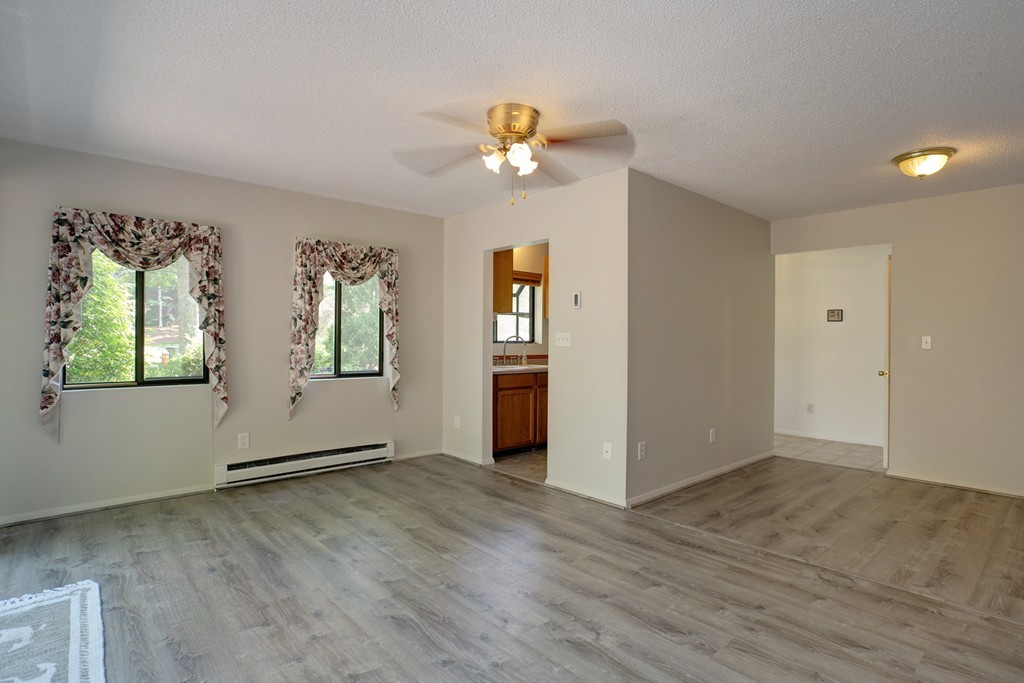 20 Round House Road, Unit 20 Bourne, MA 02532 - Photo 19 of 22 wooden floor in an empty room with a window