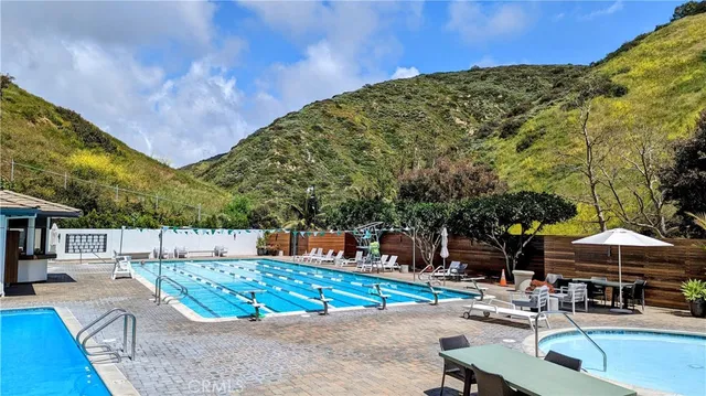 a view of a swimming pool with a patio