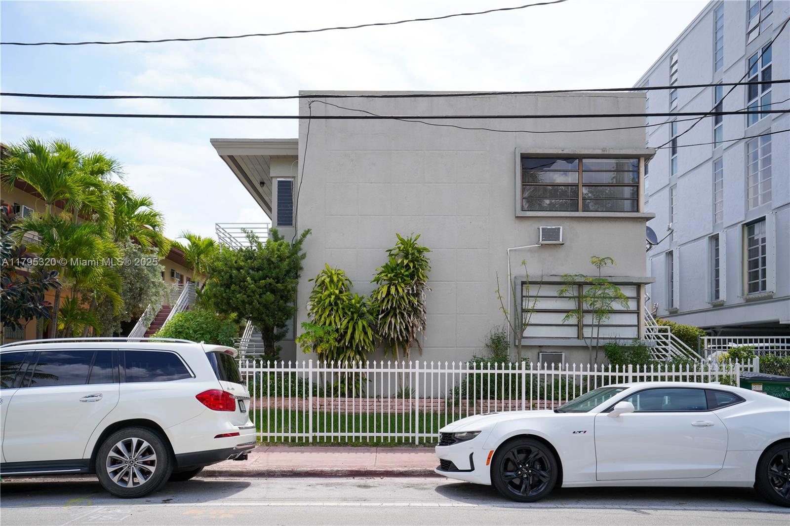 8321 Crespi Boulevard, Unit 1 Miami Beach, FL 33141 - Photo 7 of 15 a car parked in front of a house