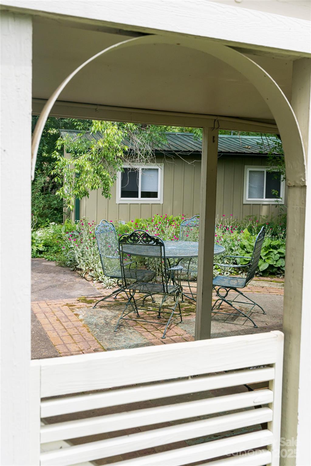75 Cisco Road Asheville, NC 28805 - Photo 12 of 47 a backyard of a house with plants and outdoor seating