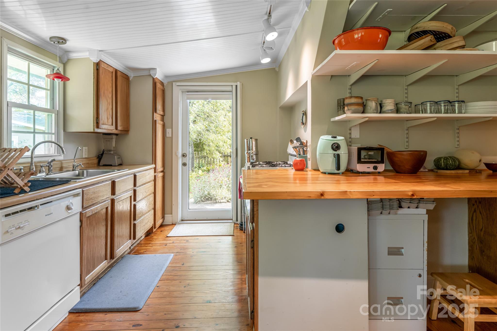 75 Cisco Road Asheville, NC 28805 - Photo 27 of 47 a kitchen with stainless steel appliances a sink a stove and a wooden floor