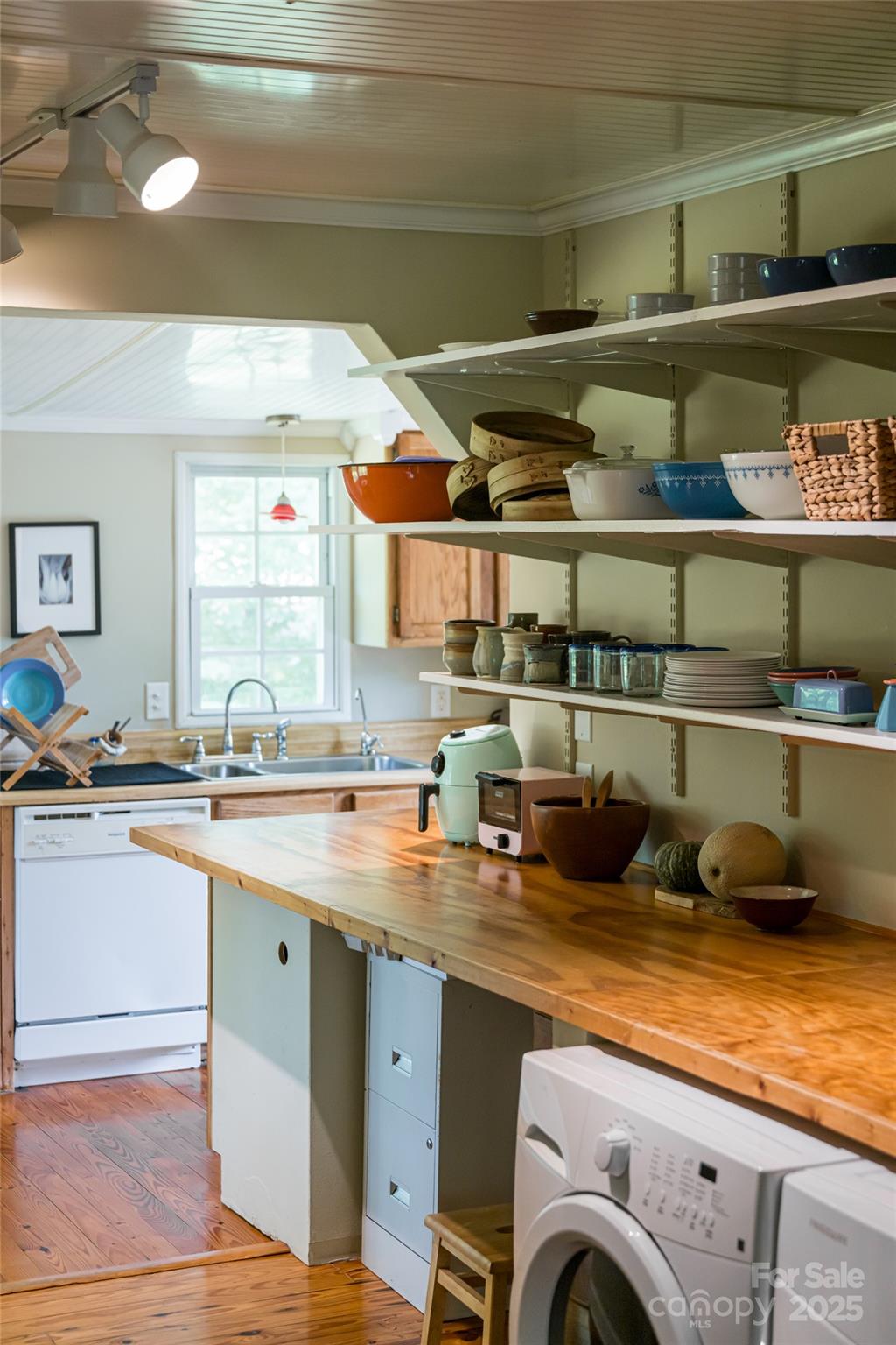 75 Cisco Road Asheville, NC 28805 - Photo 29 of 47 a kitchen with a sink and wooden cabinets