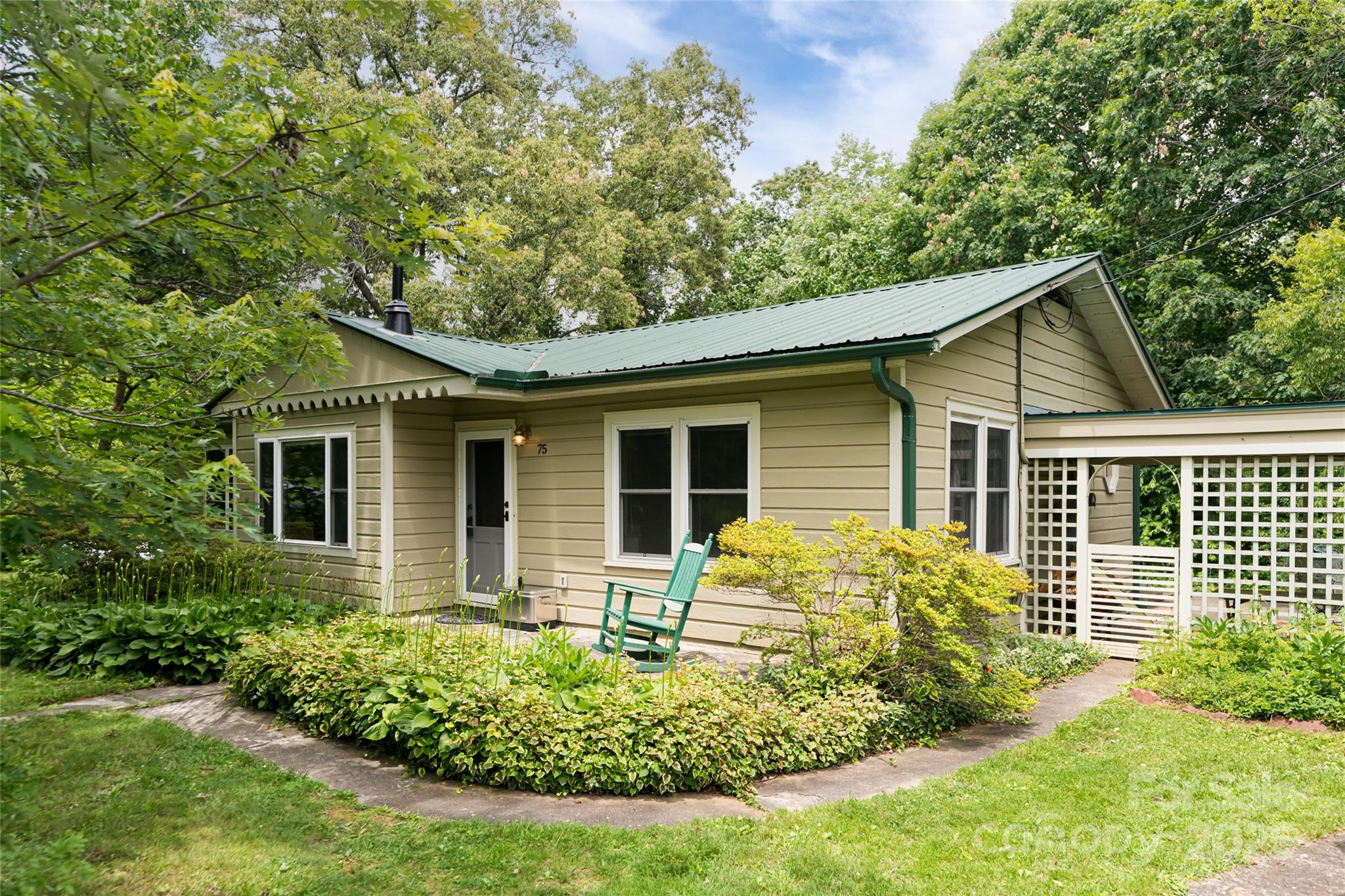 75 Cisco Road Asheville, NC 28805 - Photo 3 of 47 a front view of a house with garden