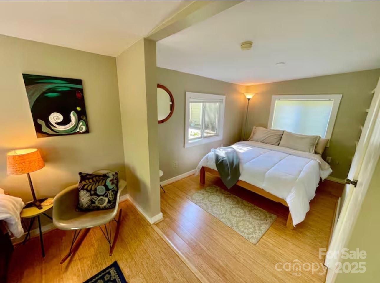 75 Cisco Road Asheville, NC 28805 - Photo 6 of 47 a bedroom with a bed and wooden floor