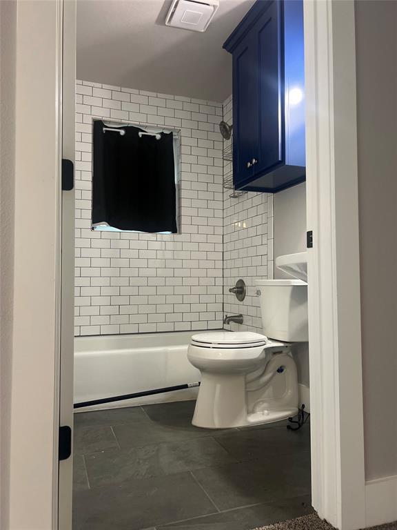 202 South 7th Street Jacksboro, TX 76458 - Photo 12 of 12 a bathroom with a toilet a sink and mirror