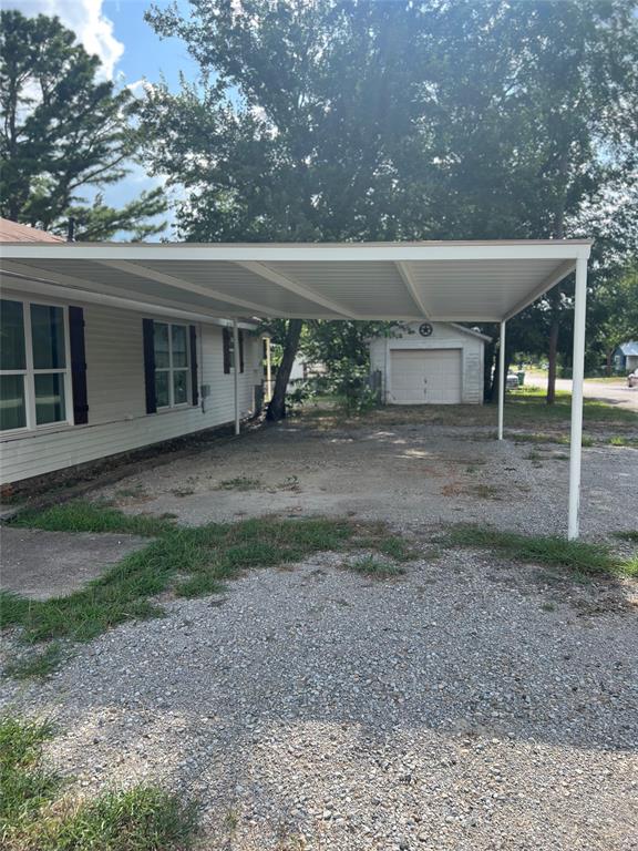 202 South 7th Street Jacksboro, TX 76458 - Photo 3 of 12 a view of a house with a backyard