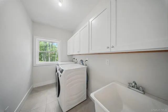 a view of a house with a yard and garage