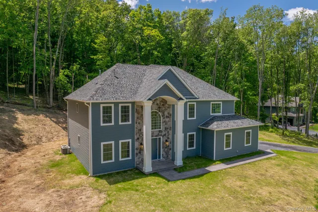 a aerial view of a house with a yard