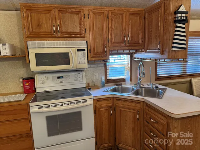 a kitchen with a stove and a microwave