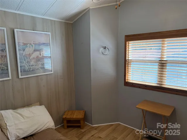 a room with a bed and a mirror