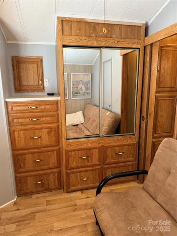 a bathroom with a sink and mirror with toilet