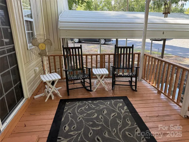 a view of a balcony with chairs