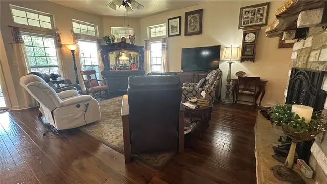 a living room with furniture and a fireplace