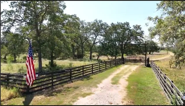 a view of a swimming pool with a patio and a yard