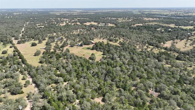 an aerial view of house with yard and mountain view
