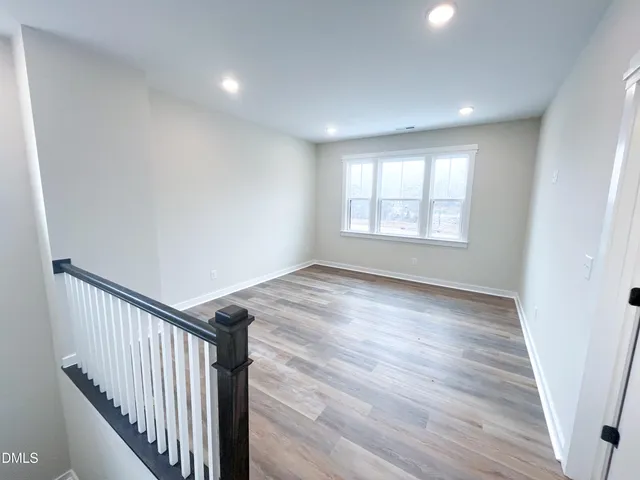a view of a lake view with a large tree in the background