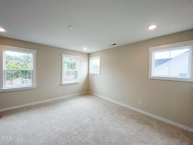 a view of a backyard with swimming pool